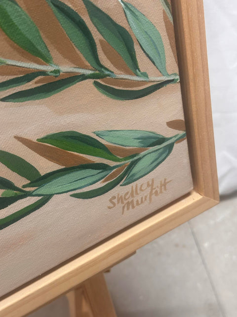 Harvest framed in wooden oak featuring asparagus, lemons and olives