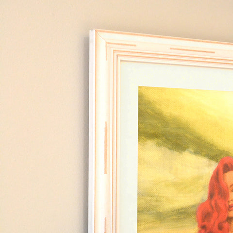 distressed white frame with beautiful red haired lady painting