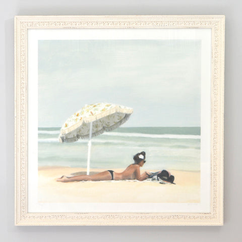 feminine beach wall art with topless lady relaxing under umbrella